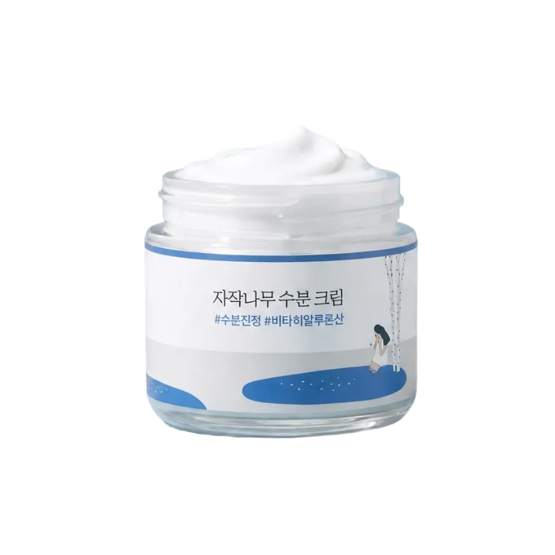 Skincare jar on a blue stone with branches and leaves in the background